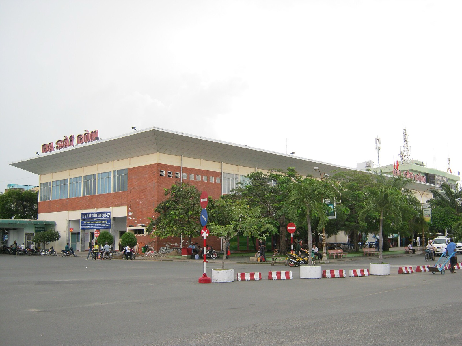 Saigon Railway Station in Ho Chi Minh City, a long low terminal building with its red Ga Sai Gon sign, on a bright day